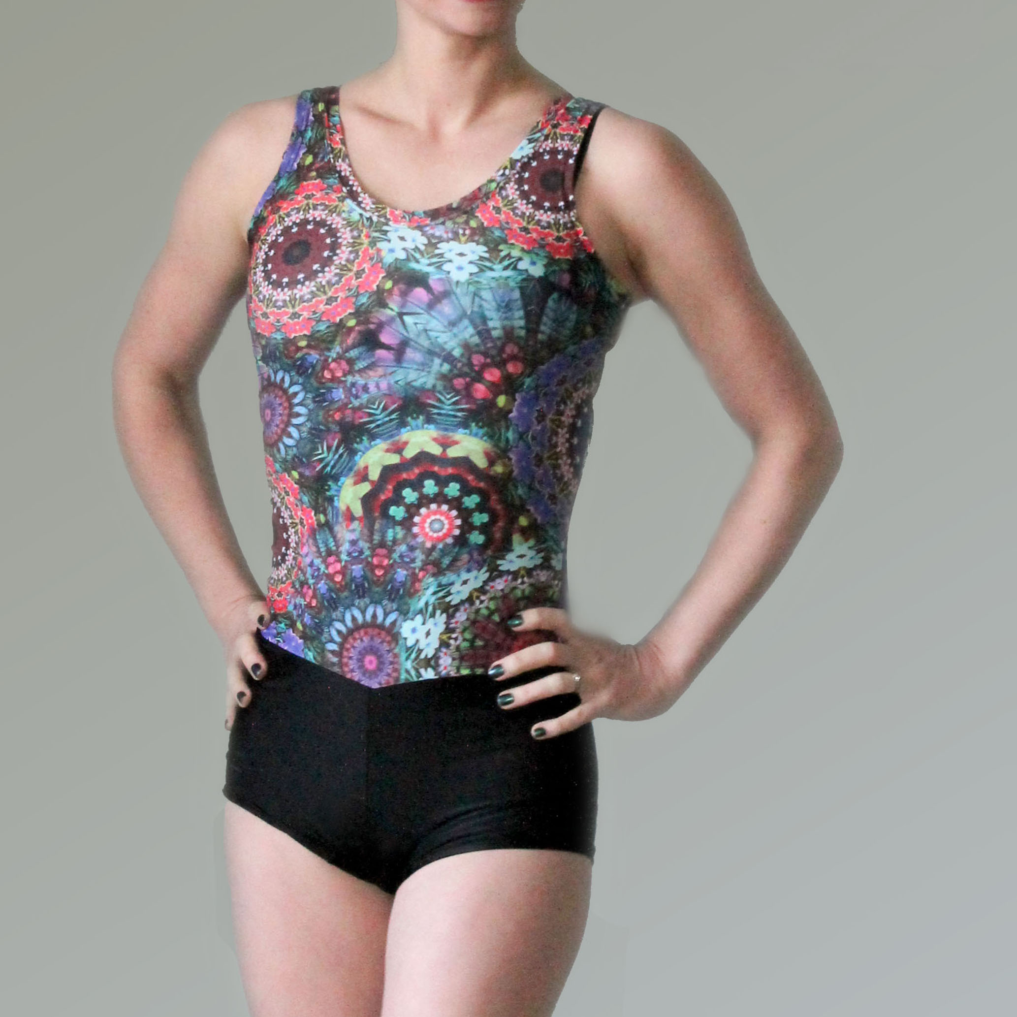 A patterned and black tank leotard on a woman's body